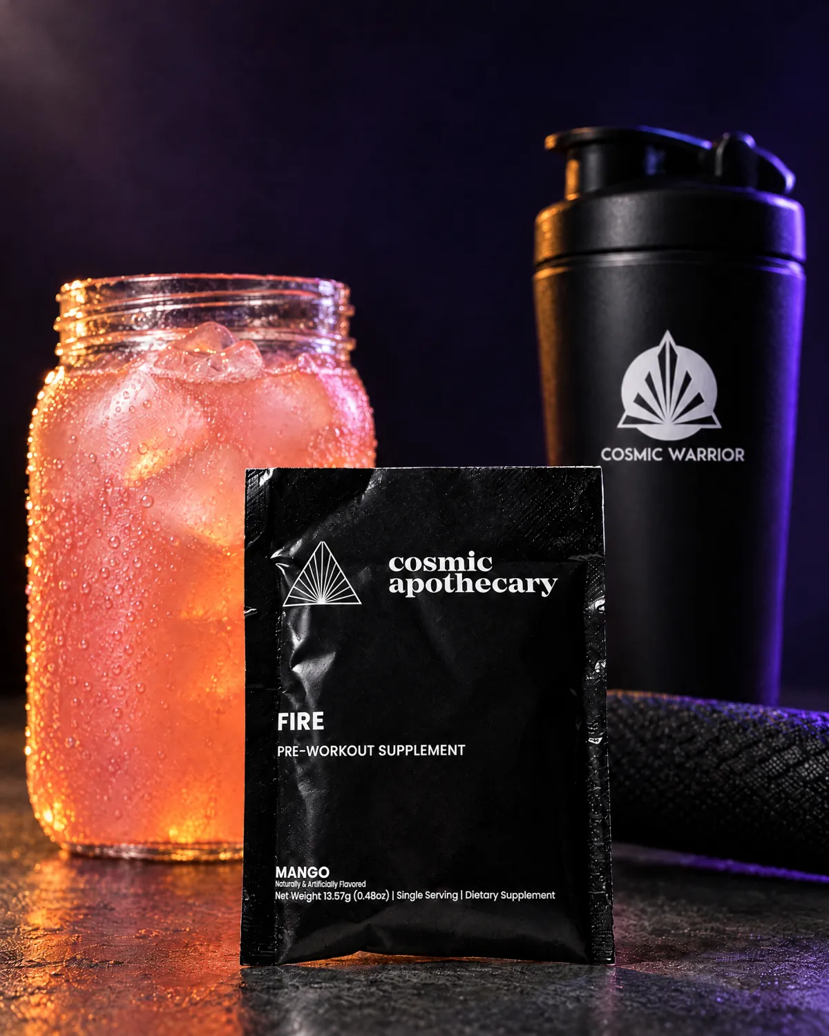 A Fire mango pre-workout sachet with mango slices and orange powder